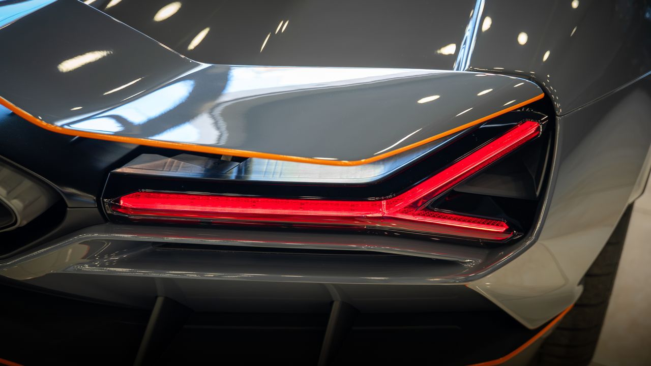 services-02 Detailed shot of a luxury cars rear tail light with sleek design and modern look.